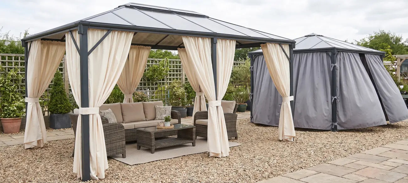 Garden pavilion and gazebo with fitted fabric curtains on display