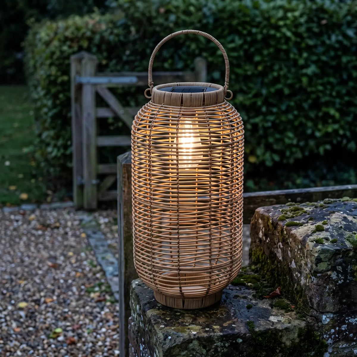 Solar Lantern Ø24 x H45 cm glowing on a mossy stone gate pillar at dusk